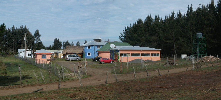 Figure 1. The Boroa Filulawen Intercultural Health Center, pictured here, is led by Mapuche community leaders, including legal representative Don Antonio Huircan (co-founder), Director Don Rolando Curiqueo, and ragiñelwe (intercultural health facilitator) Don Abelino Pichicona (co-founder); and the longko (ancestral political leaders), Luis Silverio Colimil Lizama, Mario Bonito Pichicón, y Pedro Rayman Licanqueo. Day-to-day operations are overseen by the clinic executive team led by Carlos Benito, Dr. Fabiola Silva, and Marcelo del Río, and made possible by many committed staff. This work would not have been possible without their leadership and dedication; chaltu may kom pu che (thank you everyone). Photo credit: Boroa Filulawen.